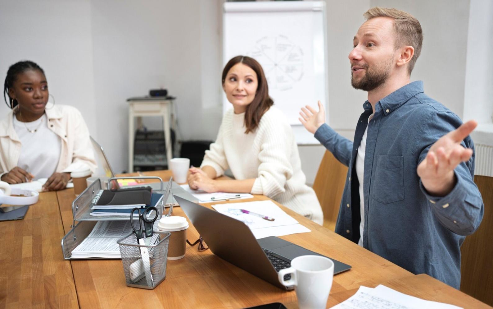 Python developer working on code with multiple monitors showing different aspects of a web application project